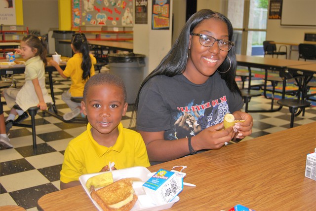 Kayla with boy breakfast